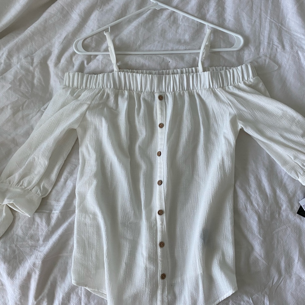 Off the shoulder , off white top